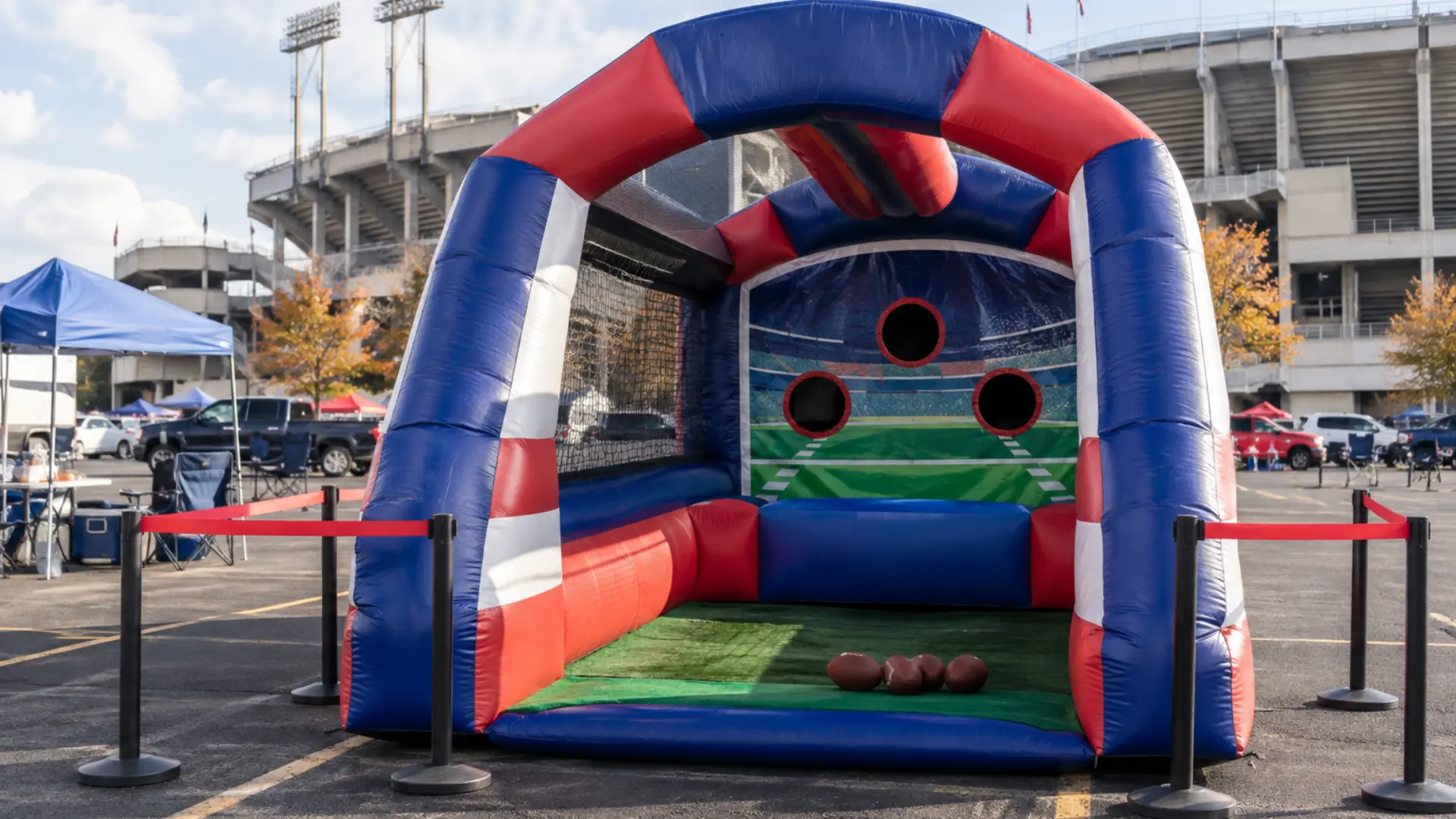 branded inflatable fan zone game station set up outside a stadium on game day