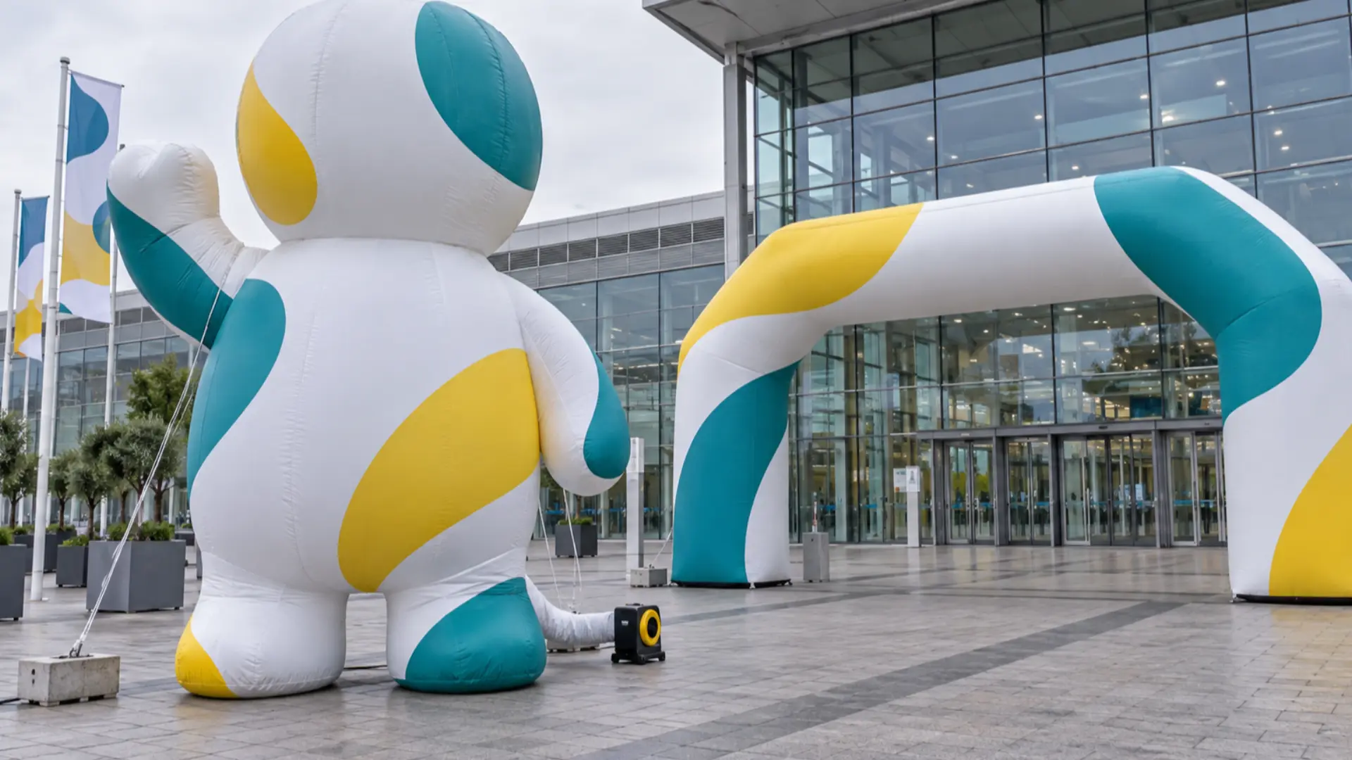 custom shaped inflatable advertising figure and printed inflatable arch at a European exhibition centre